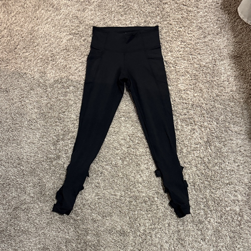 Athleta women XS Black Leggings with cross on the back - partially open calf